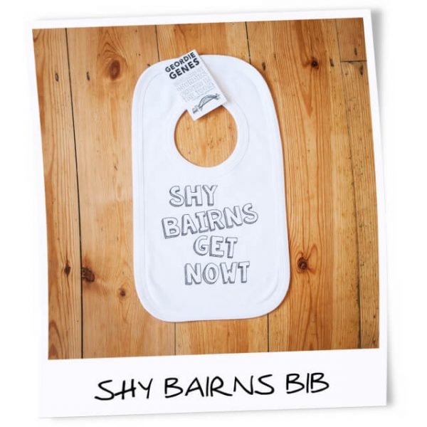 White cotton bib printed with the geordie saying, shy bairns get nowt
