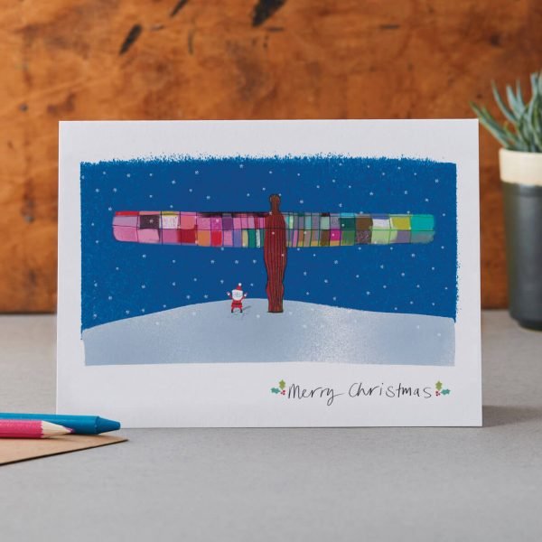 christmas card featuring an illustration of santa standing at the foot of the angel of the north