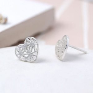 A pair of silver lattice heart earrings with a scratched frosted finish.