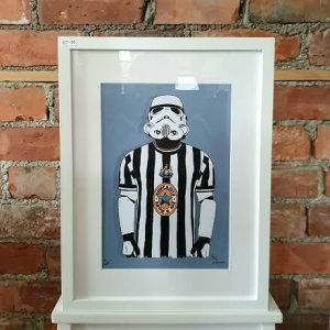 an a4 print of an illustration of a stormtrooper wearing a newcastle united football top