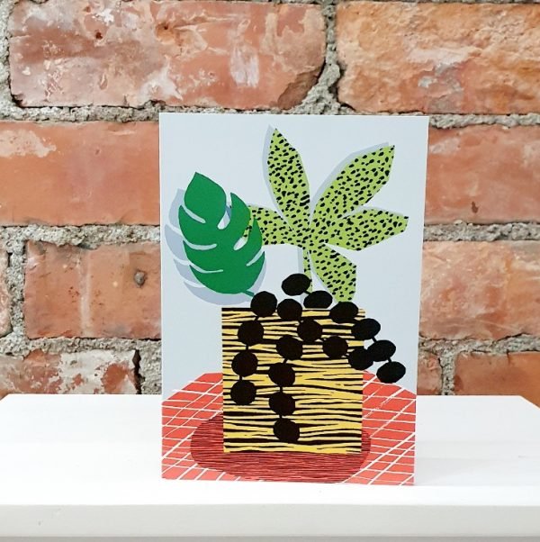 Blank greetings card featuring a brightly coloured illustration of a potted house plant