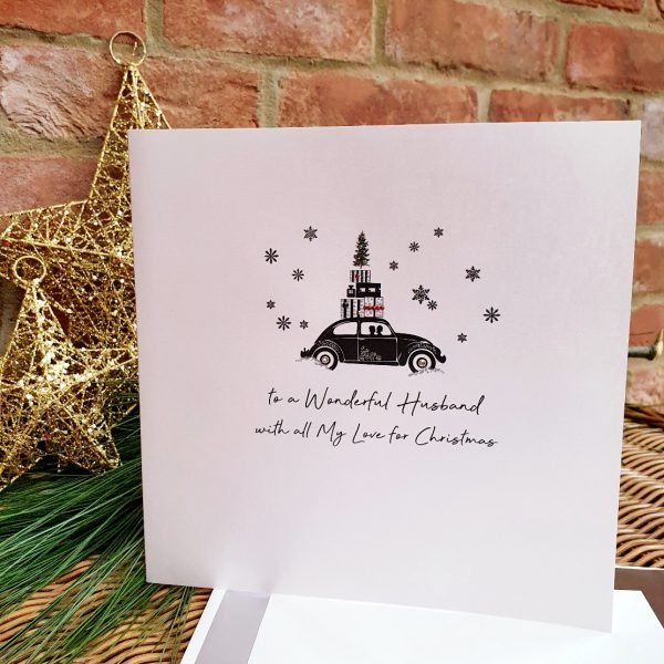 A beautiful large luxury Christmas card from Five Dollar Shake. With a car piled high with presents driving through snowflakes. Hand finished with crystals, To a wonderful Husband with all my love for Christmas