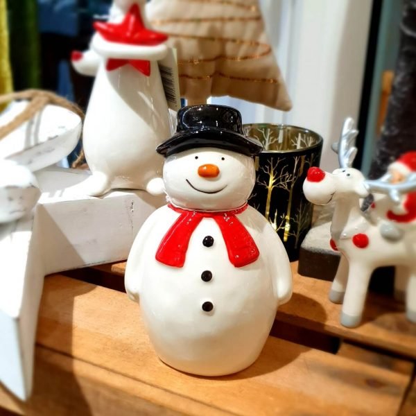 A standing ceramic snowman decoration