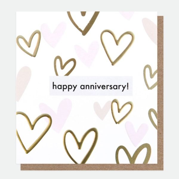 A white card with gold and pink hearts embossed and printed all over it and the words Happy Anniversary printed in the centre of it. From British card designer Caroline Gardner.