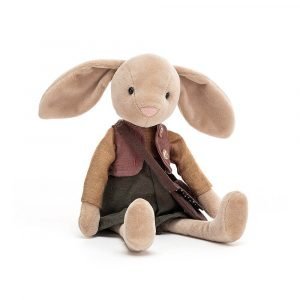 A beige bunny soft toy wearing a mustard jumper, deep rose waistcoat and holly-green bloomers and a satchel.