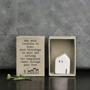 A sweet little porcelain house in a little matchbox with the words May your troubles be less your blessings be more and nothing but happines comes through your door.