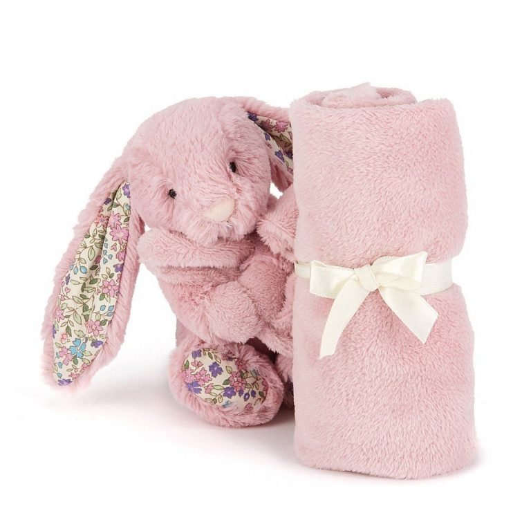 A gorgeous, soft pink bunny with flowery ears holding a silky, smooth comforter blanket. Perfect for baby girls, baby pink rabbit.
