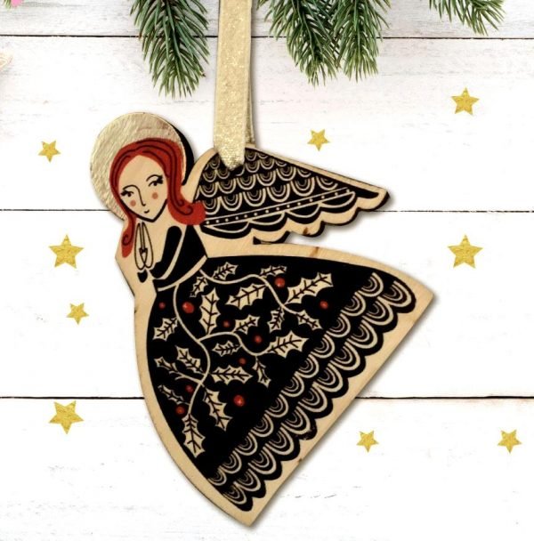 The front of a hanging wooden decoration which has been painted with an angel on it.