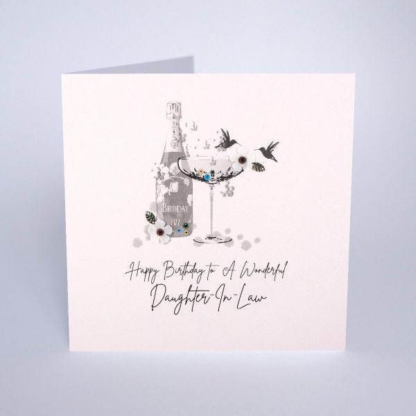 A lovely card from Five Dollar Shake with an image of a champagne bottle and glass on it with extra jewels and sparkle. The words Happy Birthday to a Wonderful Daughter in Law.