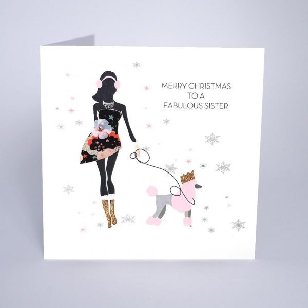 A gorgeous card with an image of a woman walking her poodle which is wearing a gold crown. There are colourful embellishments on the card and the words Merry Christmas to a Fabulous Sister are printed on the card.