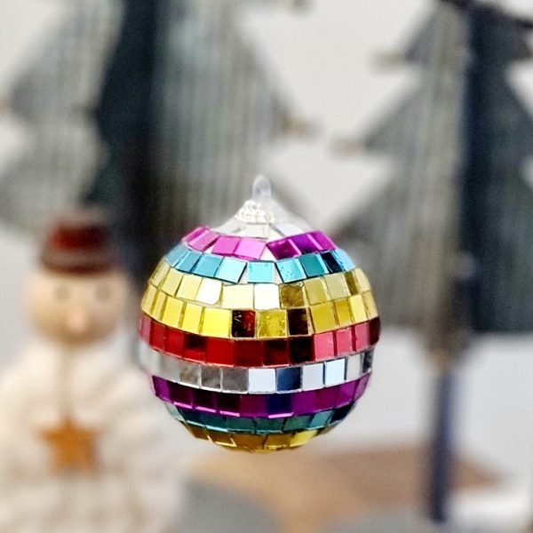 A rainbow disco ball bauble in a classic disco ball style with rainbow coloured glass beading