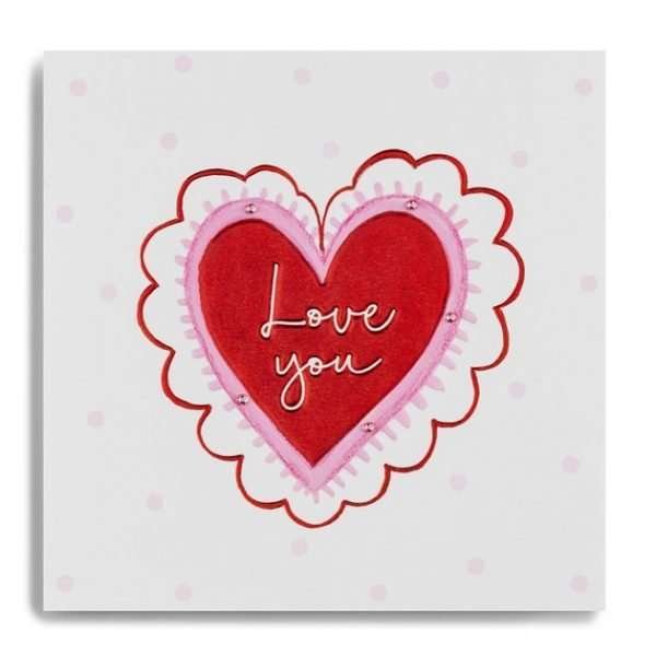 A Valentine's day card with a big red heart with Iove you in white in the red heart