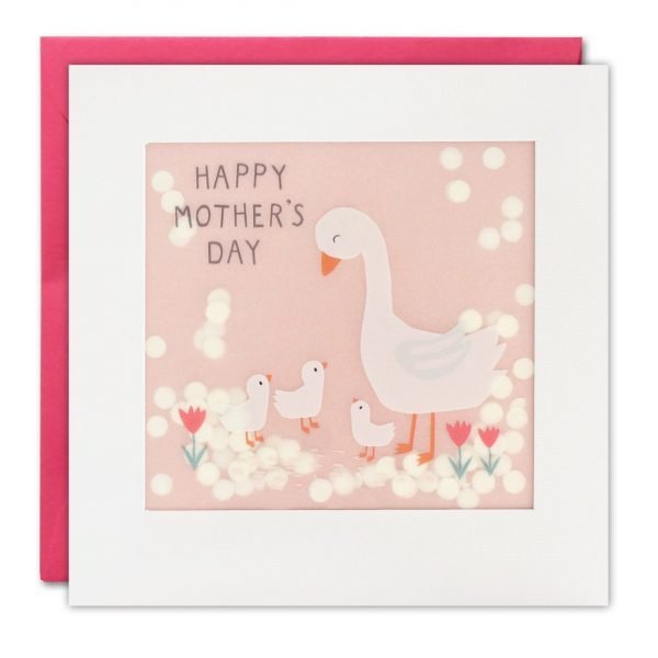 A Mothers Day card with a white mother goose looking down at three little goslings, surrounded by pink flowers. The text on the front of the card reads 'Happy Mother's Day'. The image is printed on translucent paper, showing cream paper confetti dots behind. The confetti moves around when you shake the card.