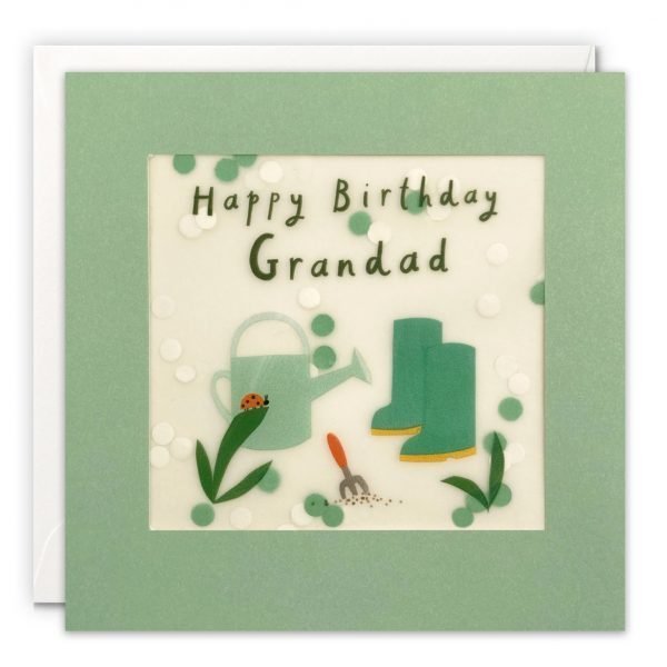 A Grandad birthday card featuring a gardening image of wellies, a watering can a fork and a ladybird on a leaf. The message on the front reads 'Happy Birthday Grandad'. The image is printed on translucent paper, showing cream paper confetti dots behind. The confetti moves around when you shake the card. The card is green