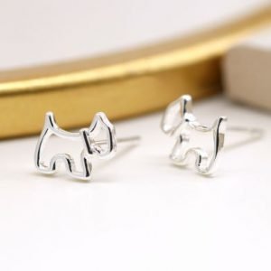 A pair of sterling silver stud earrings that are shaped like a scottie dog.