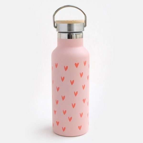 A metal water bottle in pink decorated with lots of little red hearts
