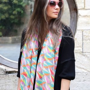 Mixed pastels scarf made from Repreve, a yarn created from recycled plastic bottles, featuring a beautiful geometric semi-circles print