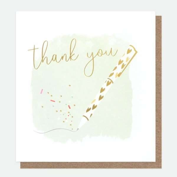 A thank you card with a pen writing in gold.The pen is white with gold hearts and thank you is written in gold