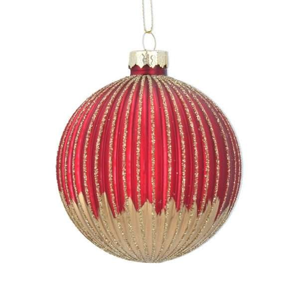 A red ribbed glass Christmas bauble with gold glitter