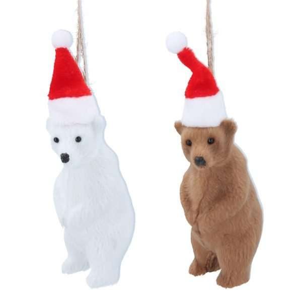 A faux fur bear in either brown and white with a red Christmas hat