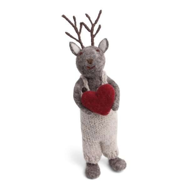 A large standing felt reindeer in white dungarees holding a red heart