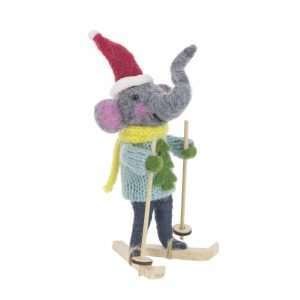 A grey felt elephant on skis in a blue jumper, yellow scarf and a festive Christmas hat