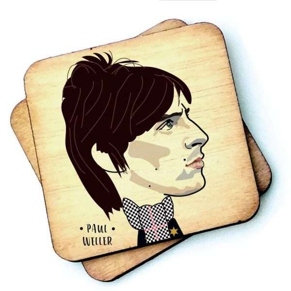 A wooden coaster with a drawing of Paul Weller