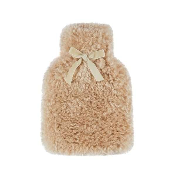 A curly faux fur hot water bottle in beige