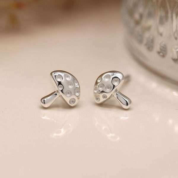 A lovely pair of terling silver toadstool studs with hammered effect and butterfly clasp fastening.