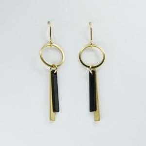 handmade earrings with 2 brass bars one black oxidised brass hanging from a brass circle