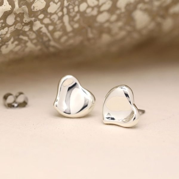 Silver plated heart stud earrings with a gentle wave surface and polished finish