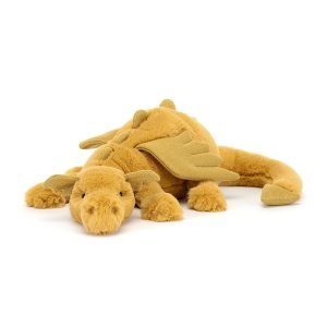 A golden coloured cuddly dragon from Jellycat. In a laying down position with a cute face sparkly wings and a long furry tail