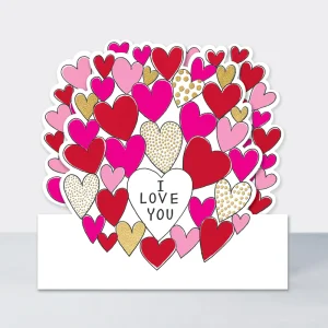 A die cut card with lots of pink hearts and I Love You in one of them