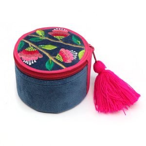 Round velvet trinket box in rich teal with floral embroidery and zip top with tassel