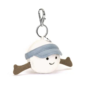 A cuddly golf ball in a blue golf visor and long arms and a cute face bag charm