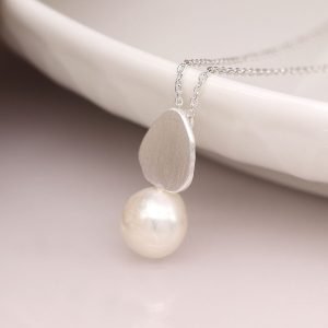 Silver plated organic teardrop shaped necklace with a brushed finish and ivory freshwater pearl