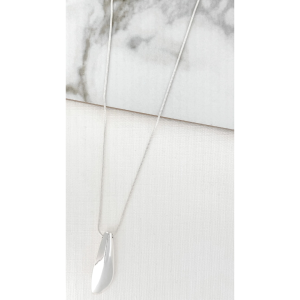 Long silver necklace with a chunky plain pendant