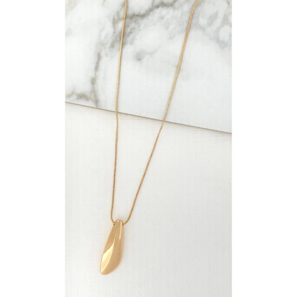 Long gold necklace with a chunky plain pendant